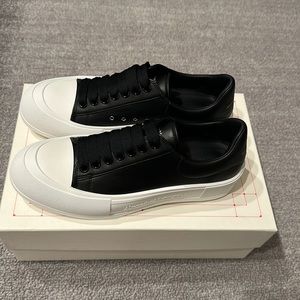 Men’s lace up plimsoll in black leather by Alexander McQueen